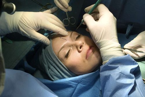 What is the difference between cosmetic and reconstructive surgery?